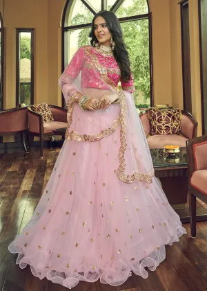 Impressive Baby Pink Heavy Net Party Wear Lehenga Choli