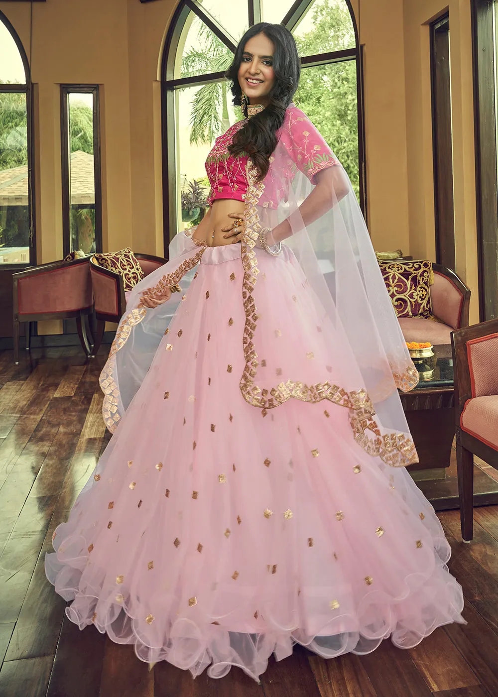 Impressive Baby Pink Heavy Net Party Wear Lehenga Choli